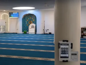 Discrete and custom-placed card donation machine on a pillar of a mosque