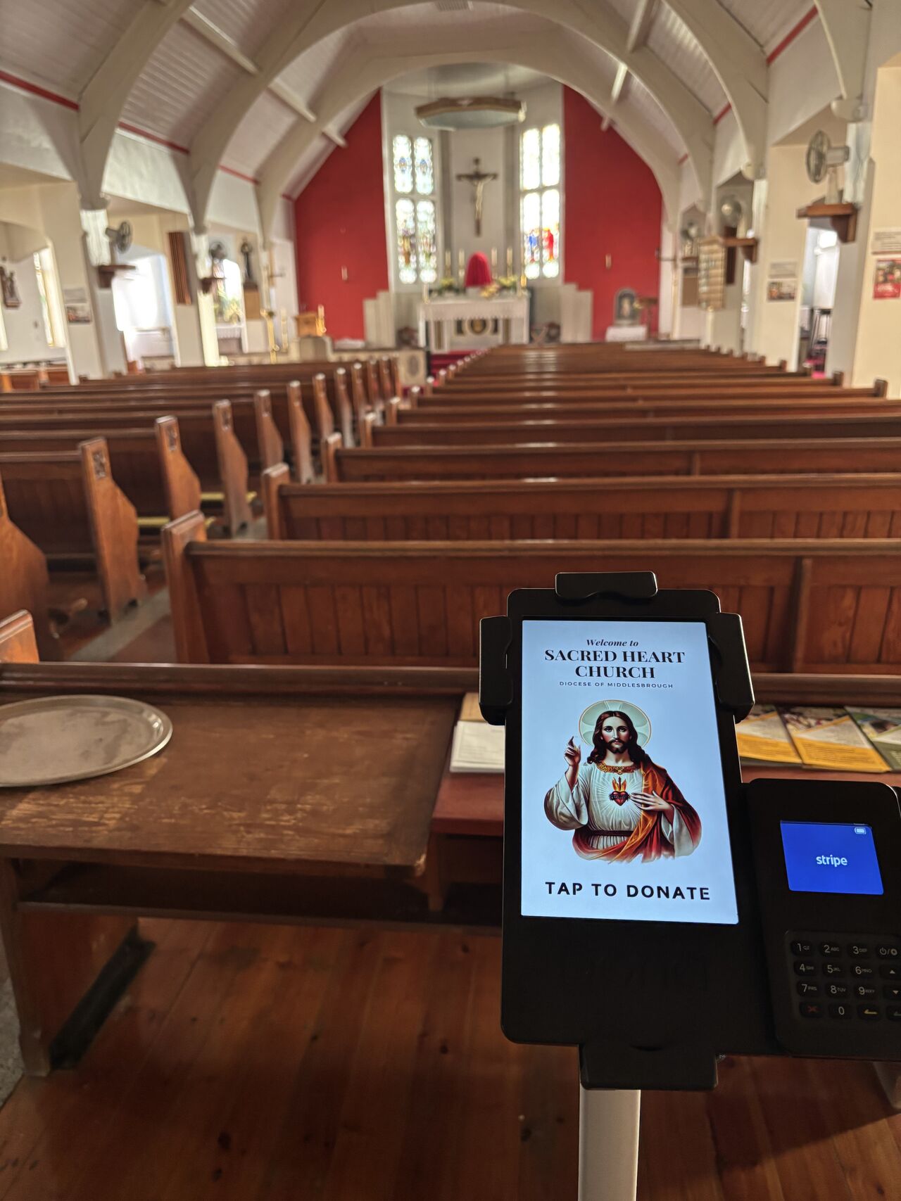 View from the entrance of the church showing the tap to donate terminal