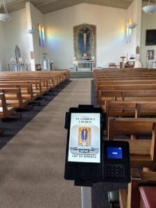 Great view of the central aisle with a donation machine ready to accept payments