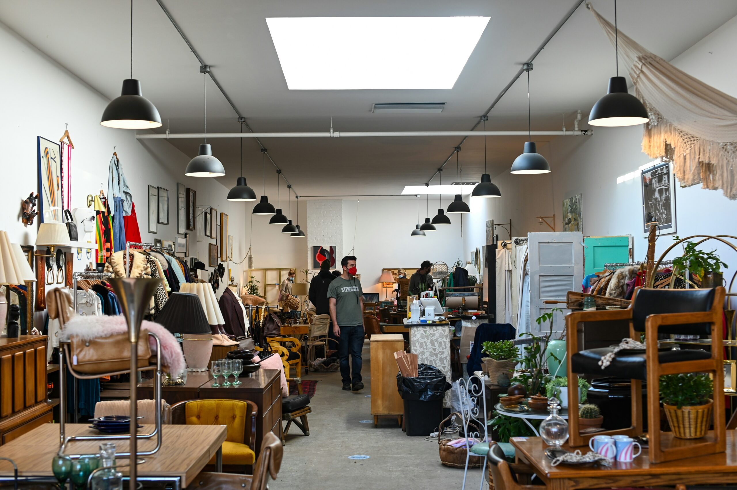 Looking into a charity shop with items for sale both sides