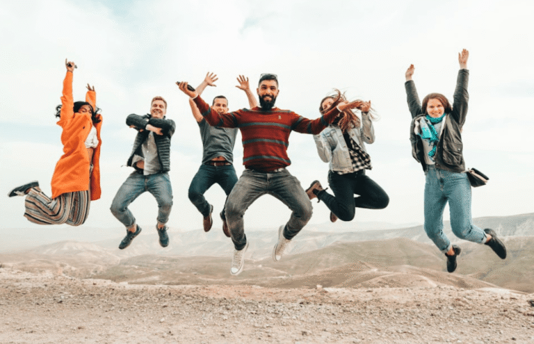 The team jumping in the air for fun