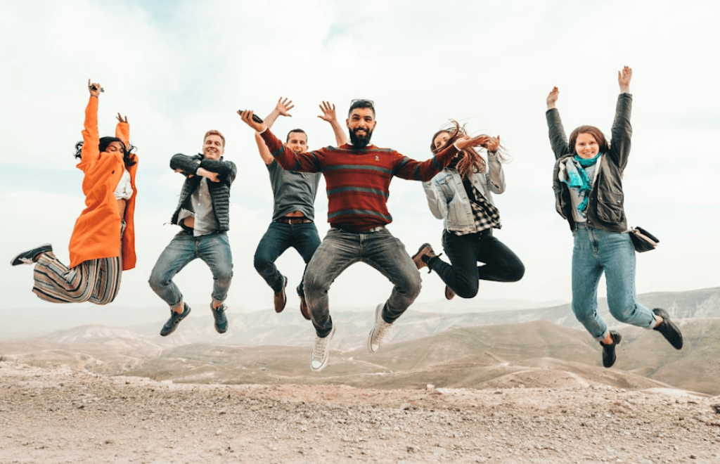 The team jumping in the air for fun