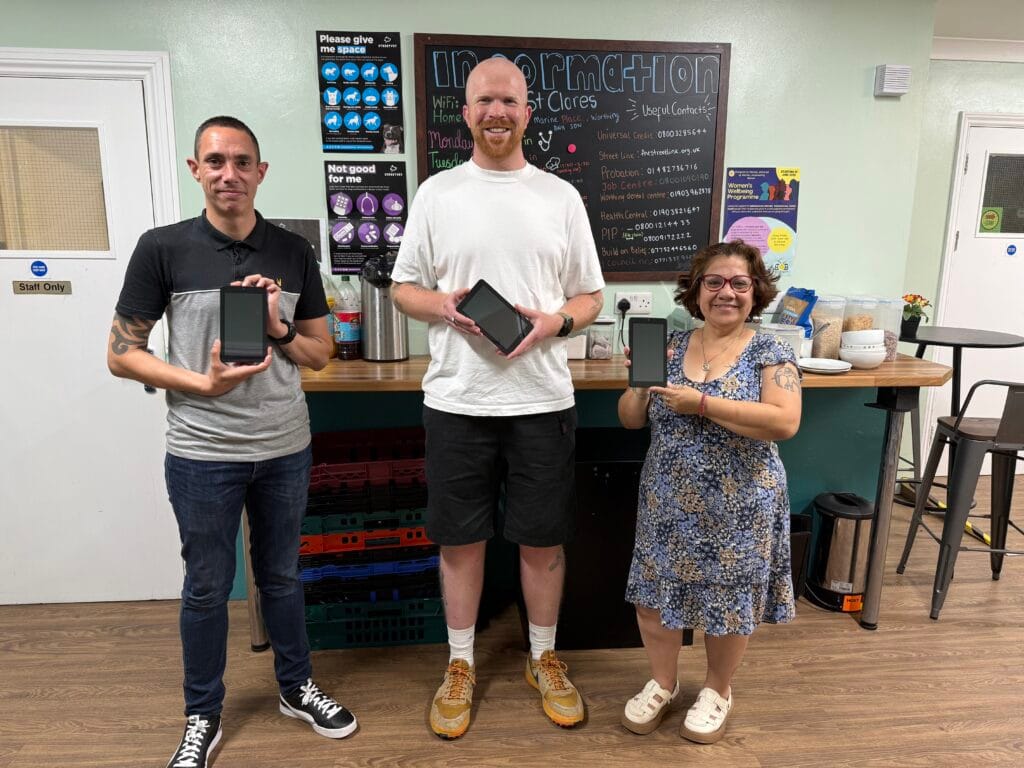 Dona tablets donated to turning tides being presented to the charity